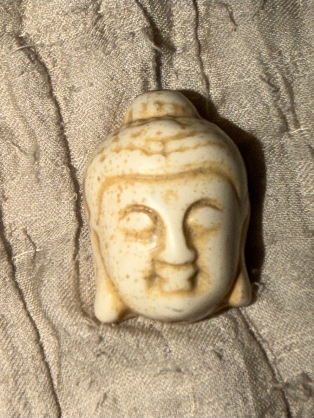 Handcrafted Cream Buddha Head bead for jewelry project